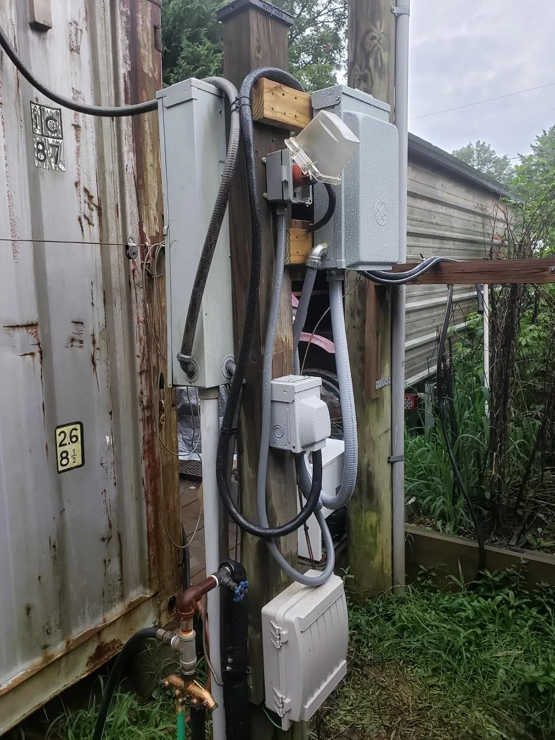 Customer photo of 240V breaker panel wiring installation in garage workshop setup