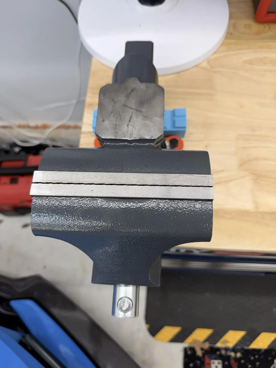 Customer photo of vintage vise after rust removal treatment showing restored metal surface